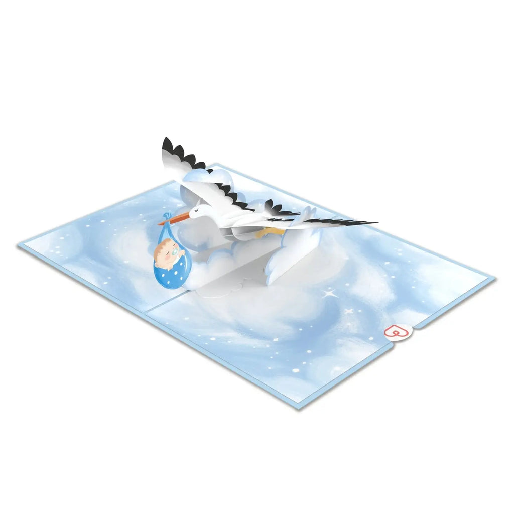 Handgemachte Pop-Up Karte zur Geburt mit Storch, blauem Babybündel und Wolken